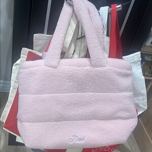 Pink handbag great for travel, zips from top